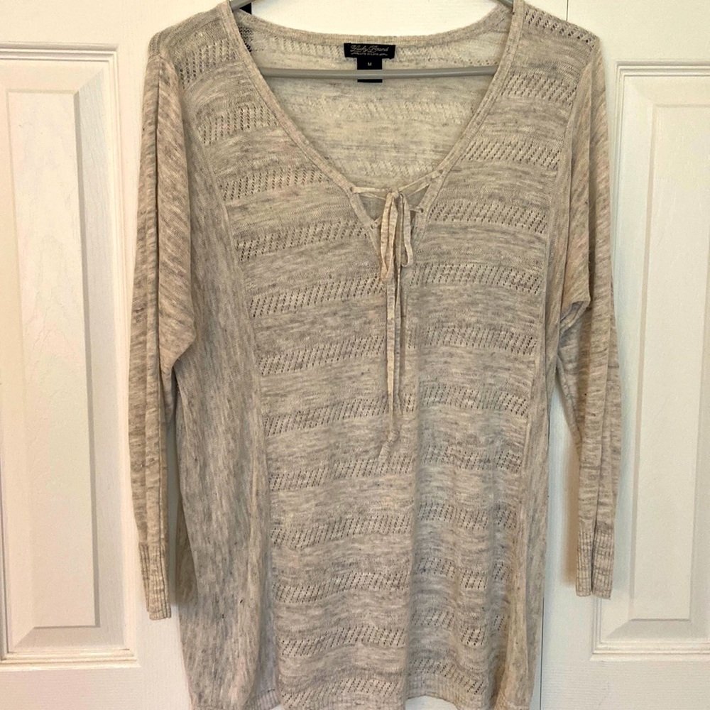 Light knit top, with lace up V neck detail
